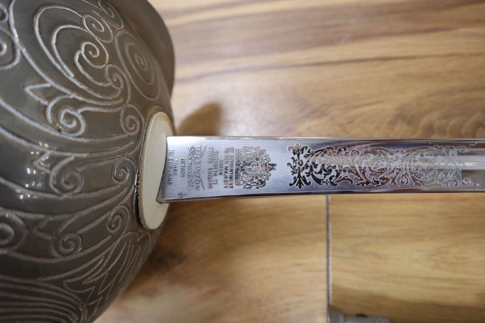 An officers sword, shagreen grip and 88cm etched, single-edged blade, in scabbard